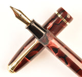 Conway Stewart 550 Dinkie in black veined light and dark red pearl marble, Gold trim - Stub nib
