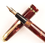 Conway Stewart 560 Dinkie in gold veined red pearl marble, Gold trim - Medium nib - Boxed